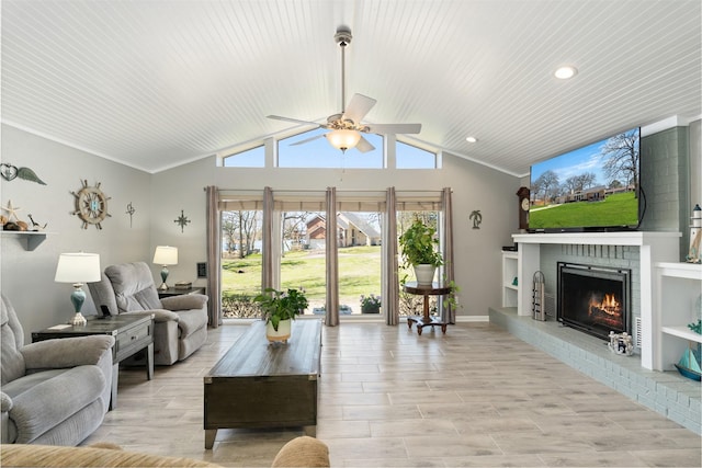 living room with a ceiling fan, baseboards, lofted ceiling, a fireplace, and light wood-type flooring