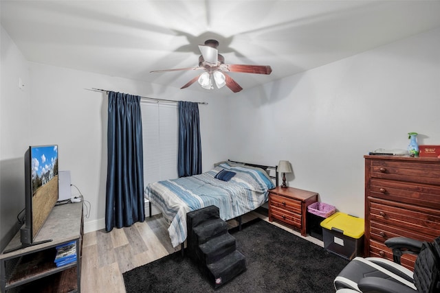 bedroom with wood finished floors and ceiling fan