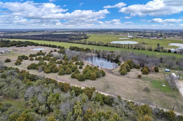 drone / aerial view with a water view and a rural view