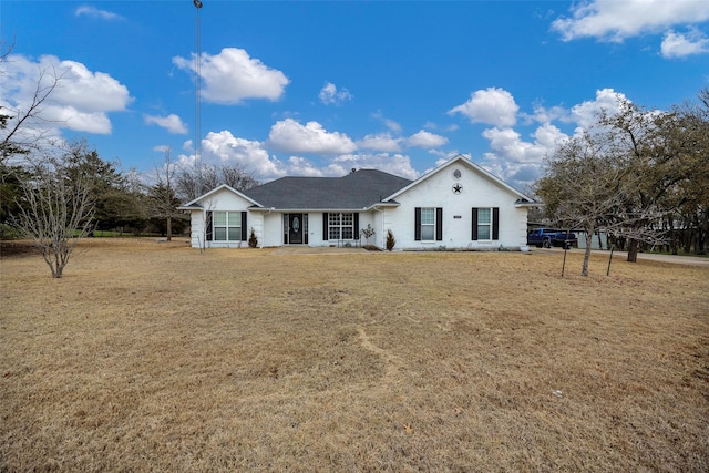 ranch-style house with a front lawn