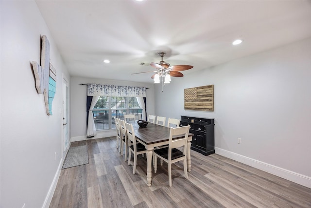 dining area featuring recessed lighting, light wood-style floors, and baseboards