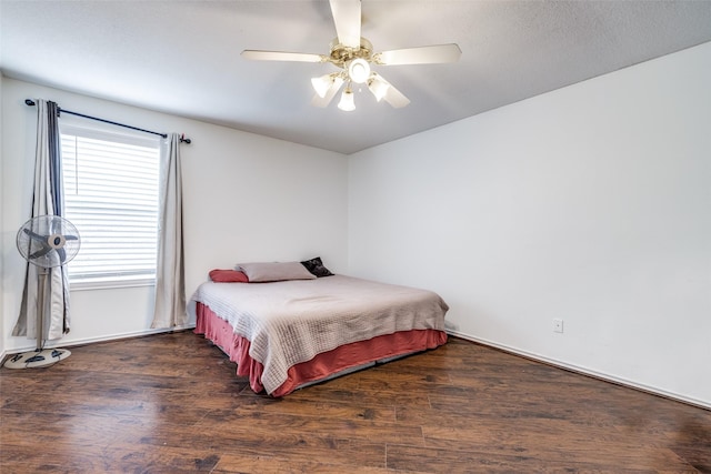 bedroom featuring a ceiling fan and wood finished floors