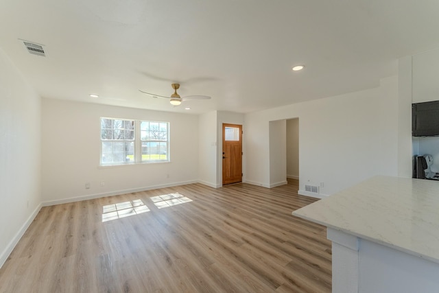 unfurnished living room with visible vents, light wood-style flooring, recessed lighting, baseboards, and ceiling fan