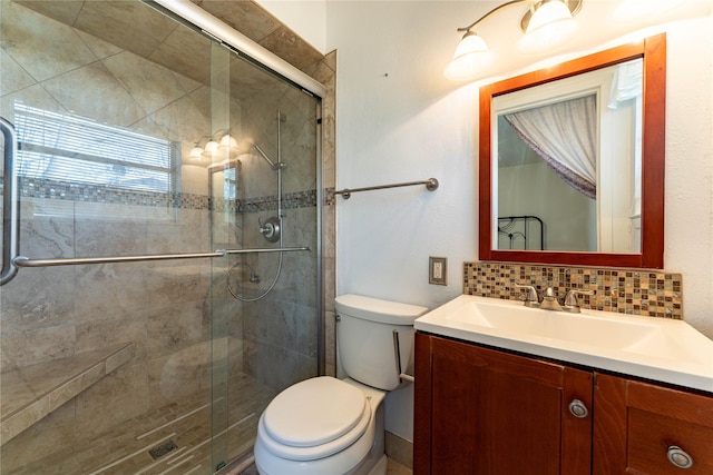 full bathroom featuring decorative backsplash, a shower stall, toilet, and vanity