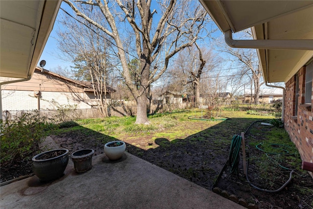 view of yard featuring a patio and fence