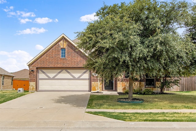 231 Archer Way, Forney, TX 75126 - view of front facade featuring brick siding, concrete driveway, a front yard, and fence
