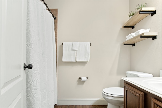 231 Archer Way, Forney, TX 75126 - bathroom with vanity, a shower with shower curtain, wood finished floors, baseboards, and toilet