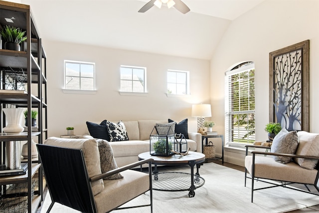 231 Archer Way, Forney, TX 75126 - living area featuring light wood-type flooring, baseboards, a ceiling fan, and vaulted ceiling