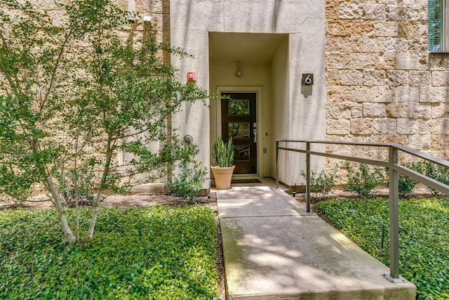 property entrance featuring stucco siding