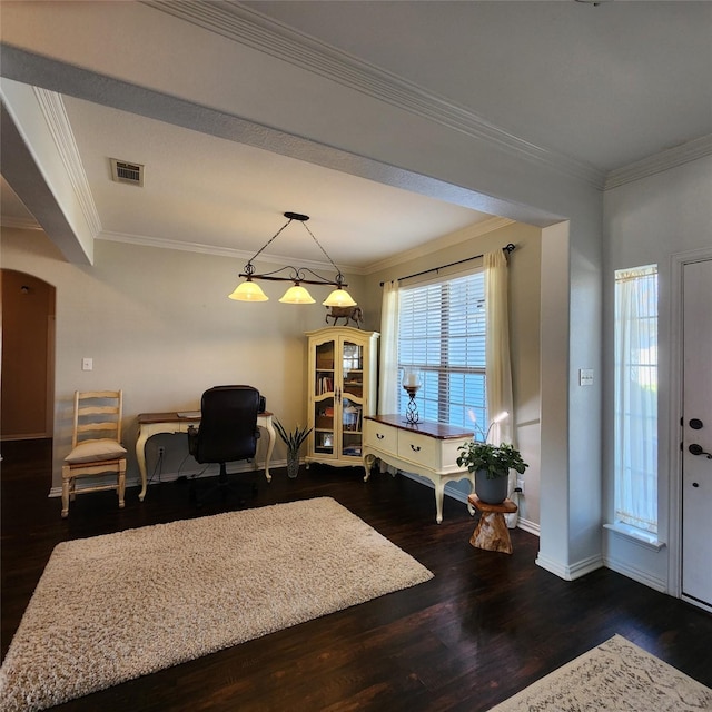 foyer entrance featuring visible vents, wood finished floors, and crown molding