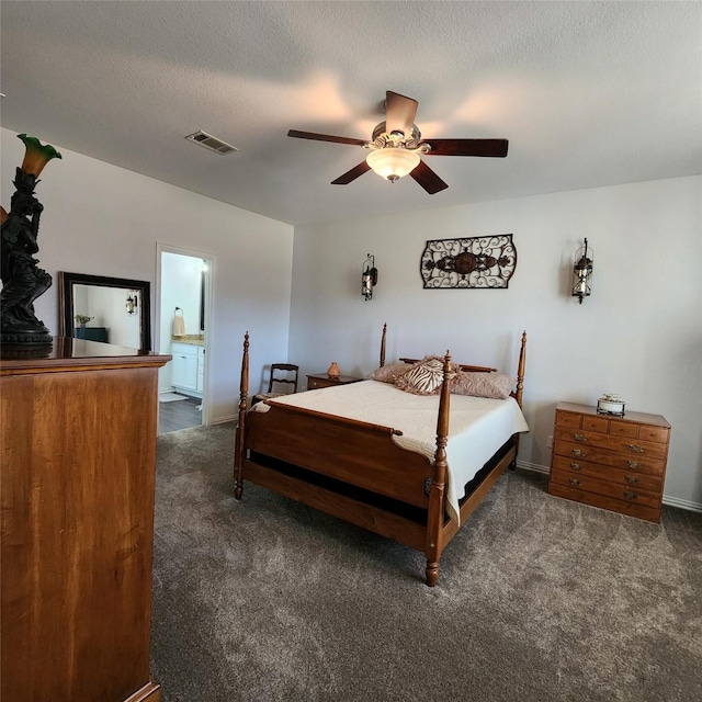 bedroom with carpet, visible vents, ceiling fan, a textured ceiling, and connected bathroom