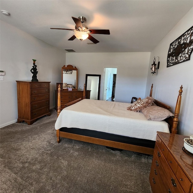 bedroom featuring visible vents, baseboards, ceiling fan, and dark colored carpet