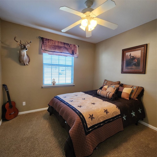 carpeted bedroom featuring baseboards and a ceiling fan