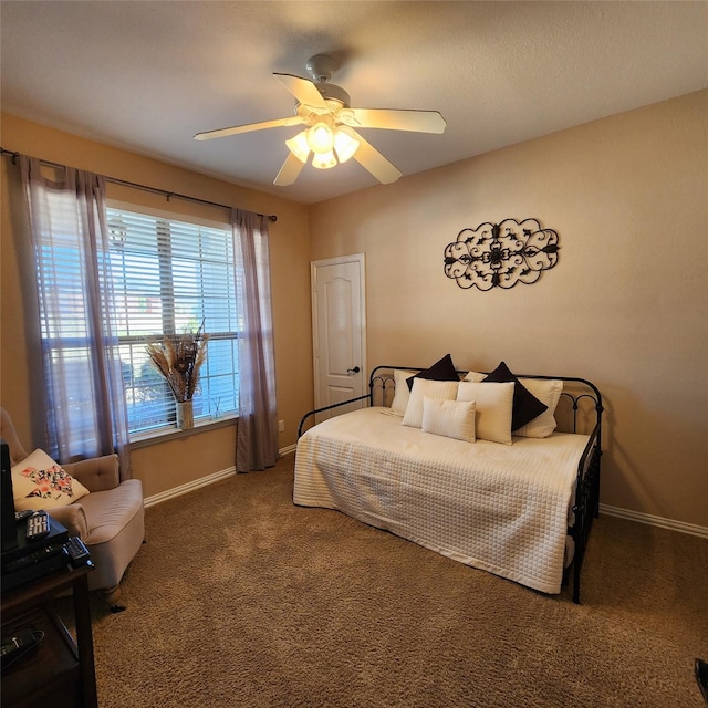 bedroom featuring a ceiling fan, baseboards, and carpet floors