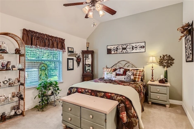 bedroom featuring light colored carpet, baseboards, lofted ceiling, and ceiling fan