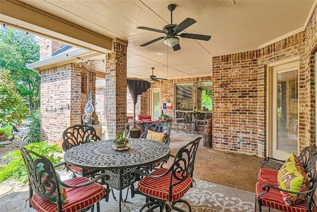 view of patio / terrace with outdoor dining area and a ceiling fan