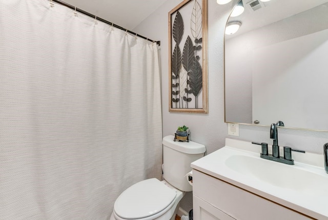 full bath with visible vents, toilet, and vanity