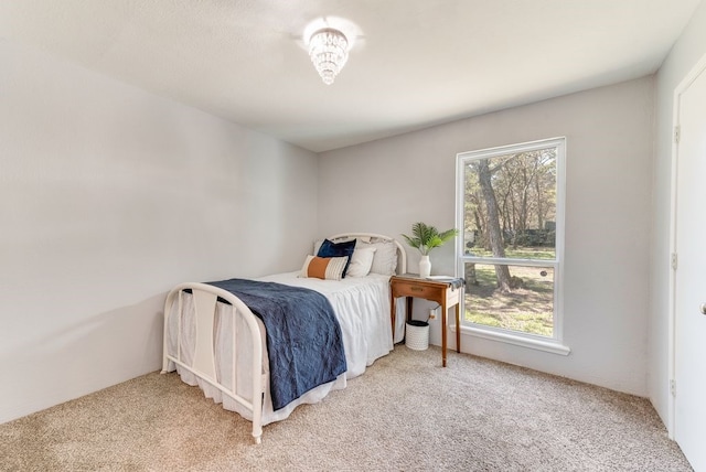 bedroom with light colored carpet