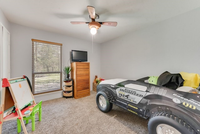 carpeted bedroom featuring a ceiling fan