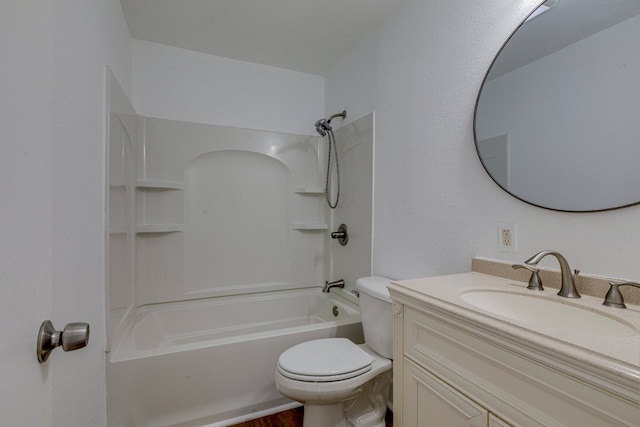 bathroom featuring vanity, toilet, and washtub / shower combination