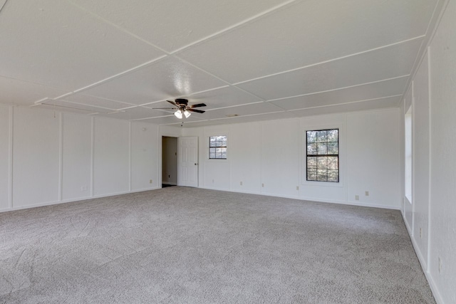 unfurnished room with ceiling fan and carpet floors