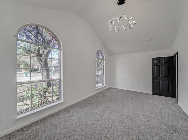 additional living space featuring vaulted ceiling, baseboards, carpet floors, and a chandelier