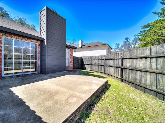 view of yard featuring a patio and fence