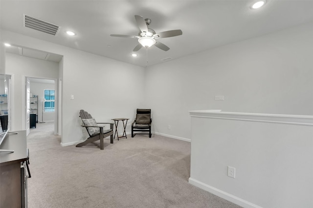 living area with visible vents, ceiling fan, baseboards, carpet floors, and recessed lighting