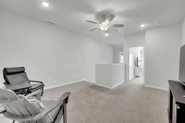 sitting room with visible vents, an upstairs landing, recessed lighting, carpet, and baseboards