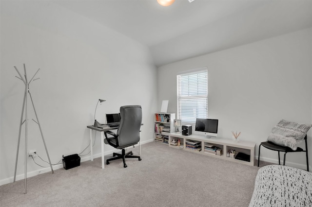 office area featuring baseboards, carpet floors, and vaulted ceiling