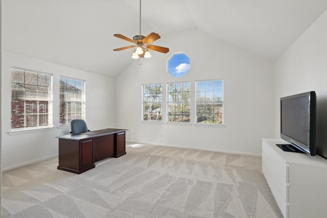 office area featuring baseboards, light colored carpet, ceiling fan, and vaulted ceiling