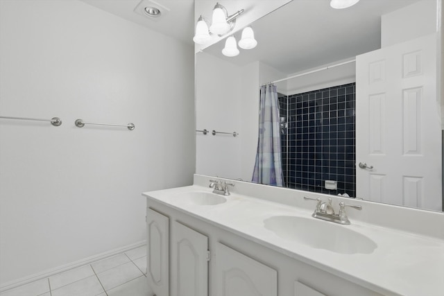 bathroom featuring tile patterned flooring, curtained shower, double vanity, and a sink