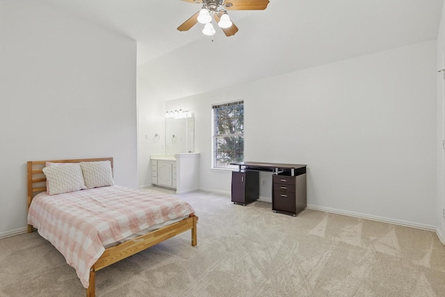 bedroom with baseboards, lofted ceiling, ensuite bath, ceiling fan, and light carpet