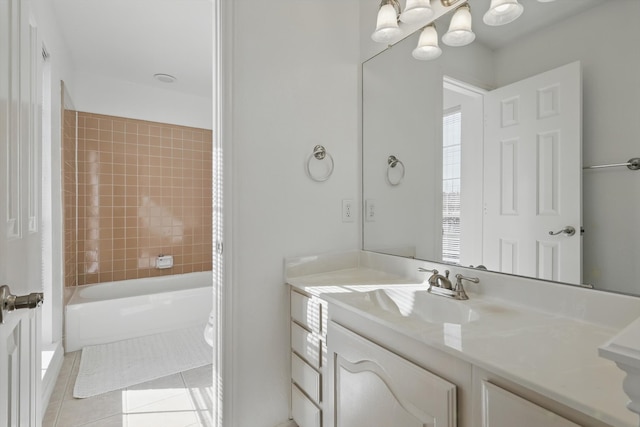 bathroom featuring vanity, tile patterned floors, and bathing tub / shower combination