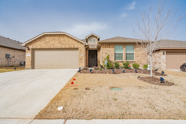 ranch-style house featuring driveway, brick siding, and an attached garage