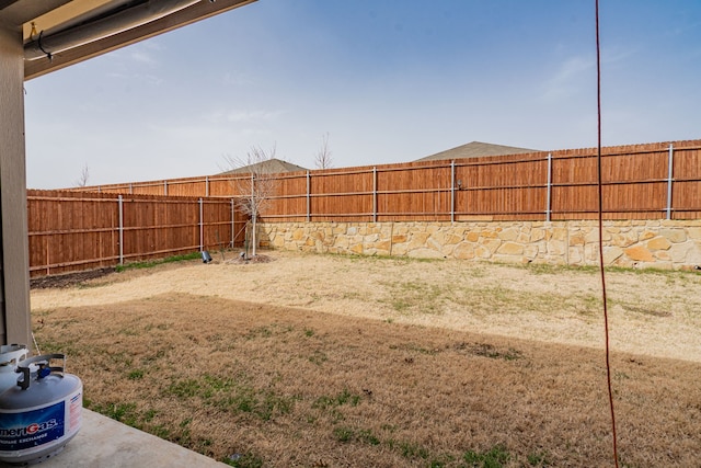 view of yard with a fenced backyard