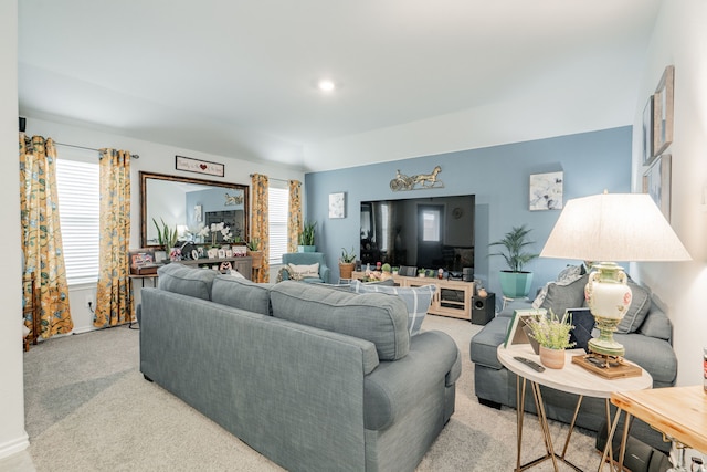 living area with light colored carpet