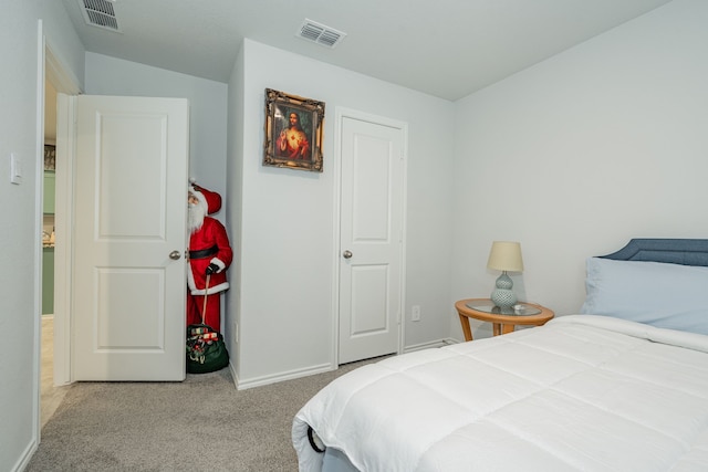 carpeted bedroom featuring visible vents, baseboards, and vaulted ceiling