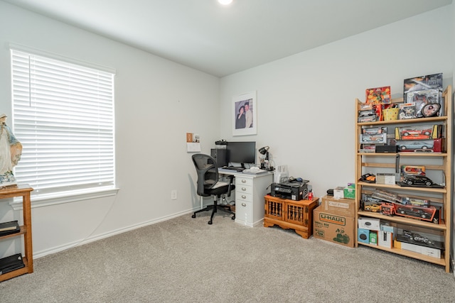 home office with baseboards and carpet floors