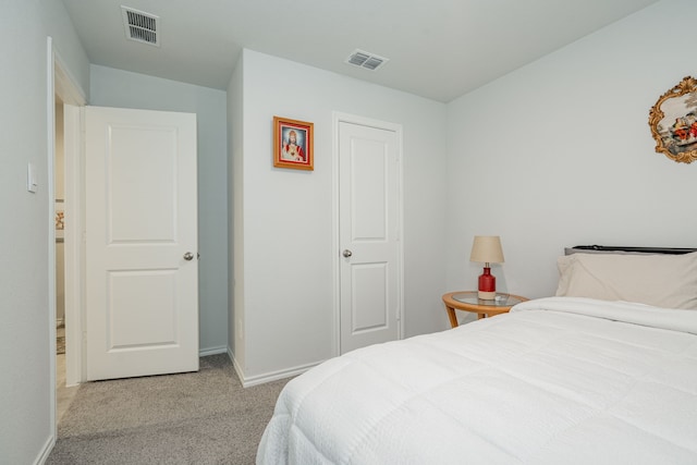 bedroom featuring visible vents, carpet flooring, and baseboards