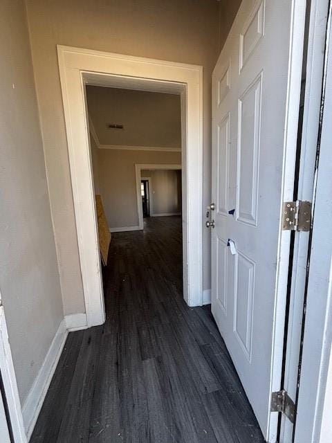 hall with baseboards and dark wood-style floors