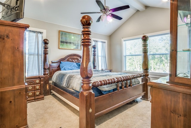 bedroom with a ceiling fan, carpet, and vaulted ceiling with beams