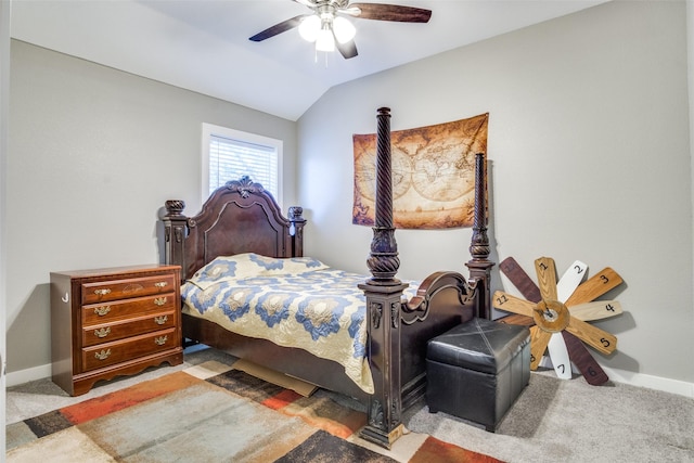 carpeted bedroom featuring baseboards, lofted ceiling, and ceiling fan