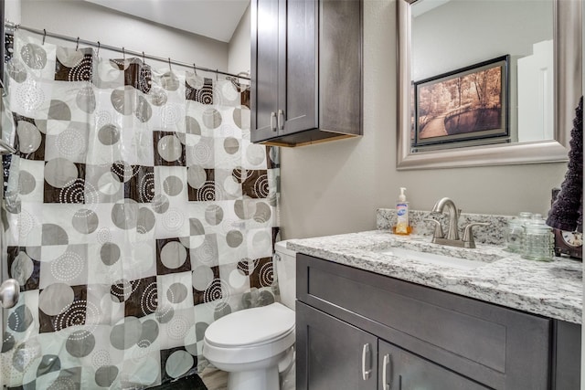 full bathroom with toilet, vanity, and a shower with curtain