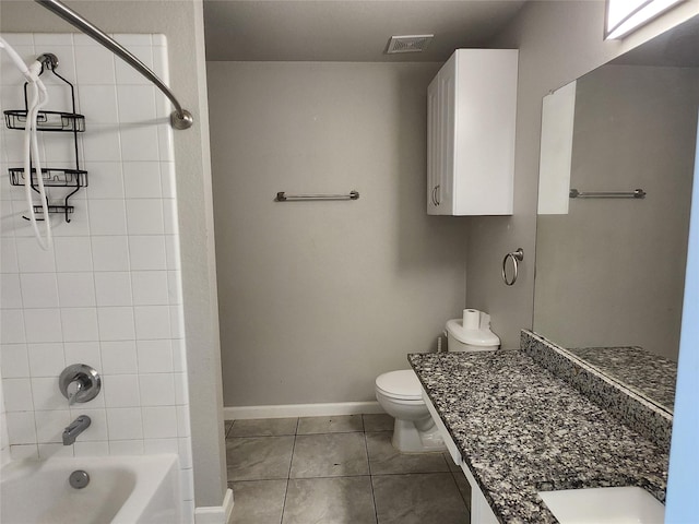 bathroom featuring visible vents, tub / shower combination, baseboards, toilet, and tile patterned floors