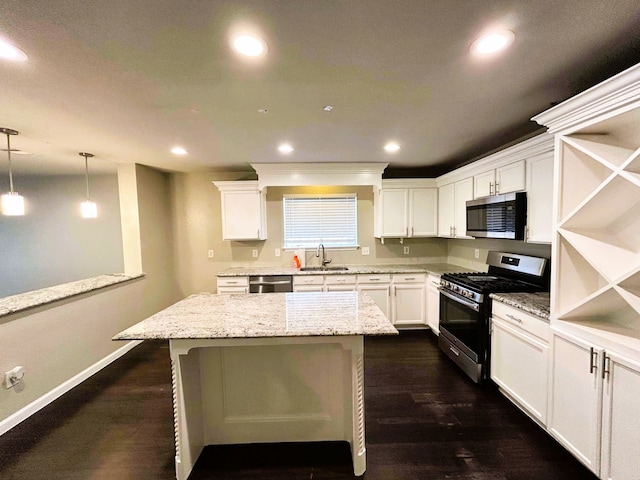 kitchen featuring a sink, appliances with stainless steel finishes, recessed lighting, and white cabinetry