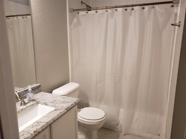 full bathroom featuring vanity, toilet, a textured wall, and shower / tub combo with curtain