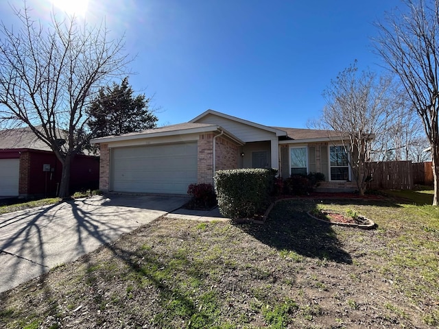 ranch-style home with brick siding, driveway, a garage, and fence