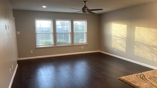 empty room with recessed lighting, dark wood-style floors, baseboards, and ceiling fan