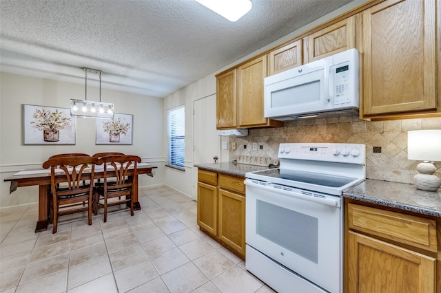 kitchen featuring pendant lighting, light tile patterned floors, decorative backsplash, white appliances, and a textured ceiling